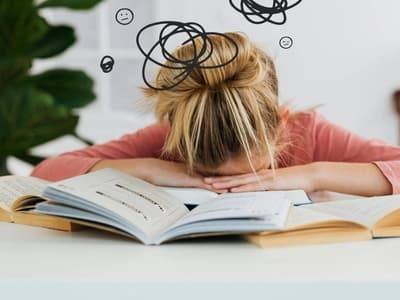 ADHD student struggles: distracted, overwhelmed, tired.