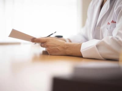 Doctor reviewing notes on ADHD diagnosis