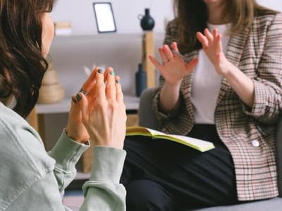 Two people discussing ADHD strategies in conversation.