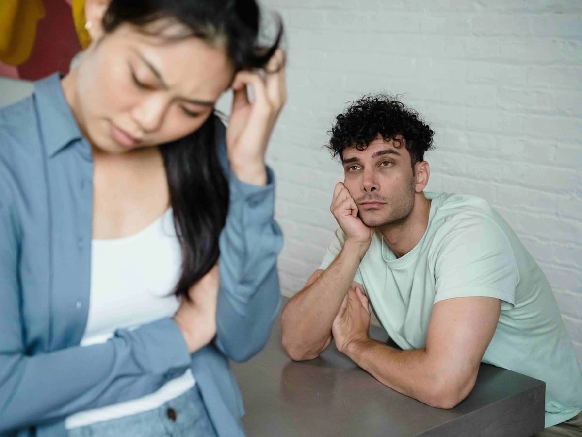 While she's lost in frustration, his mind, prone to wandering due to ADHD, has checked out, leaving him looking distant and her feeling unheard